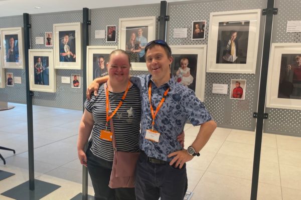 Down's Syndrome North East exhibition organisers standing in front of exhibition