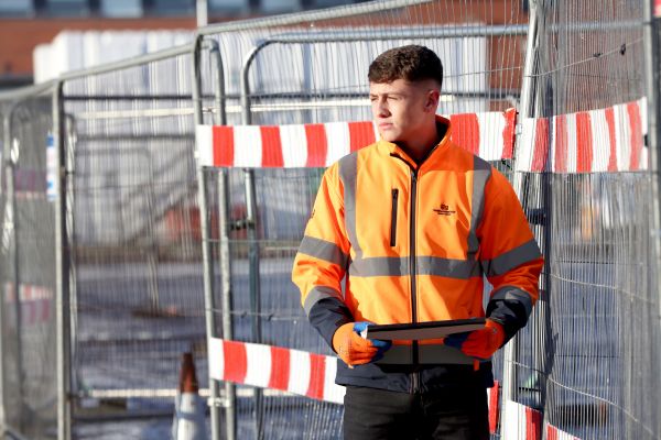 Civil Engineering Apprentice holding tablet 