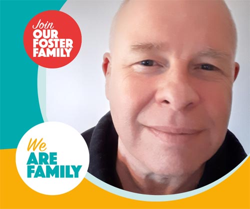 Foster carer Alan, a white man with kid eyes and a slight smile.
