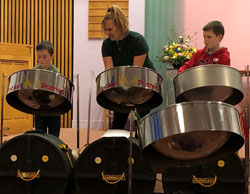 Young students playing steel drums