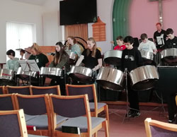 More students playing the steel drums