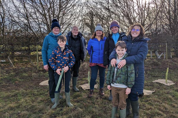 A group from Ellingham church school next to some trees they planted