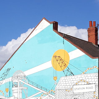 Woodhorn colliery painted on side of building in Ashington