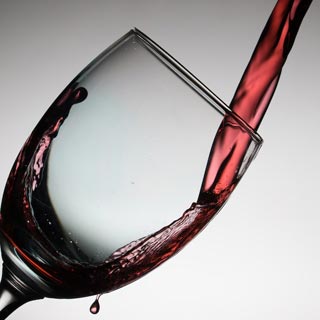 Red wine being poured into a wine glass