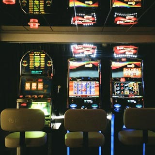 Slot machines in a row at a pub