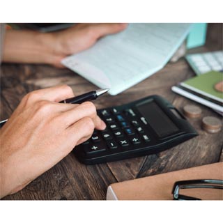 A person using a calculator for finances