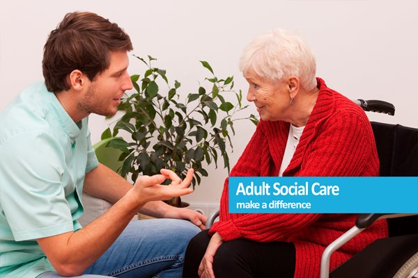 A care worker helping a woman at home