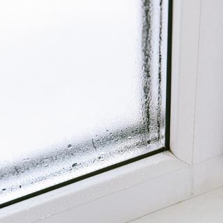 Condensation building up on the inside of a window