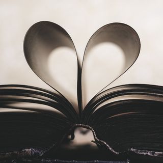 Book open with the pages shaped like a heart