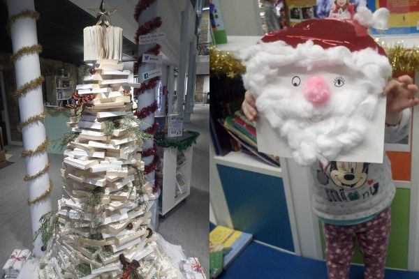 A Christmas tree made of book and a child holding a Santa mask