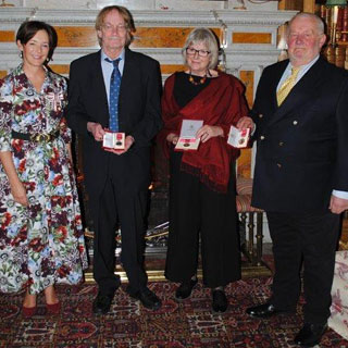 Image demonstrating Duchess presents British Empire Medals to dedicated residents