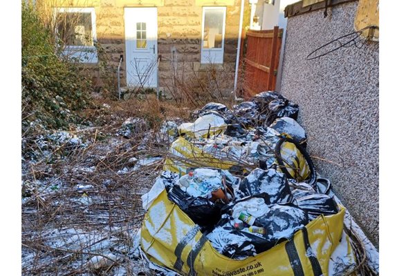Image demonstrating Residents fined for failing to clear up rubbish dumped in their gardens 