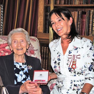 Image demonstrating Duchess presents British Empire Medals to dedicated residents 