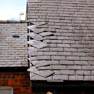 Image demonstrating Council removing loose roof slates in shopping centres 