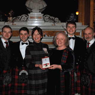 Image demonstrating Duchess presents British Empire Medal to dedicated Coquetdale resident 