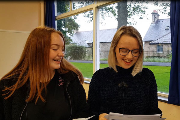 Image demonstrating GCSE students celebrate in Northumberland