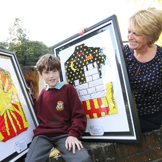 Image demonstrating Winning schools receive their Tour design jerseys 