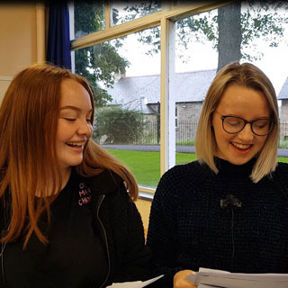 Image demonstrating GCSE students celebrate in Northumberland