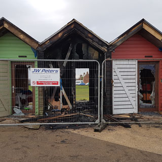 Beach huts damaged by fire