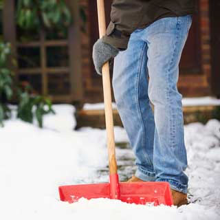 Man clearing snow from a path