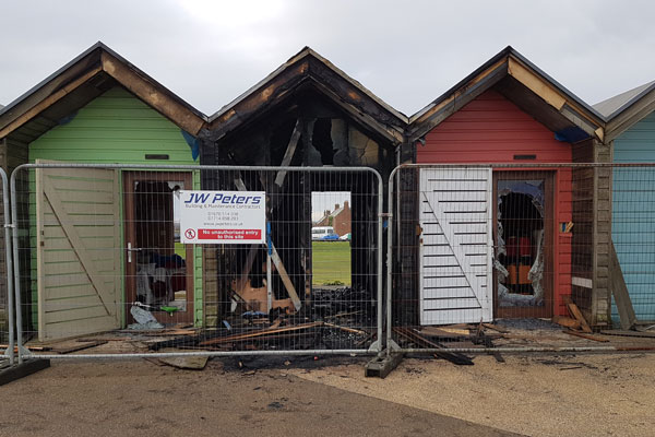 Beach huts damaged by fire