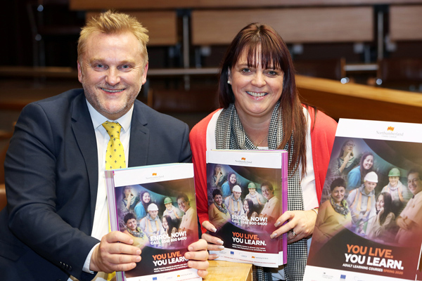 Wayne Daley and Cath McEvoy-Carr holding copies of the new brochure