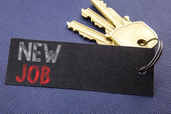 Photo of keys and new job sign