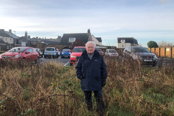 Photo of Cllr Jeff Watson at site of new car park