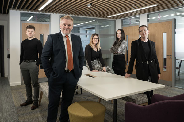 Cllr Wayne Daley with council apprentices