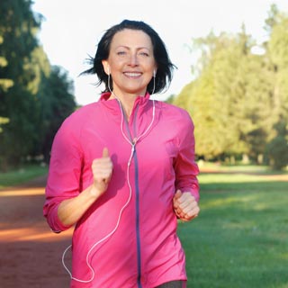 Person running in a park with earphones in