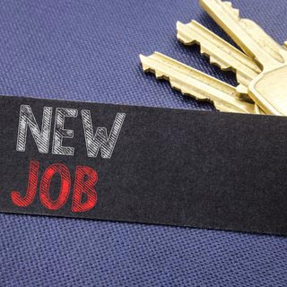 Photo of keys and new job sign