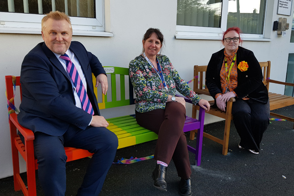 Cllr Wayne Daley on the new seats with children's centre staff