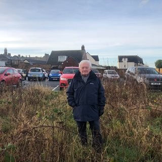 Photo of Cllr Jeff Watson at site of new car park