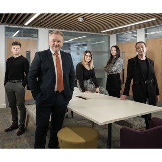 Cllr Wayne Daley with council apprentices