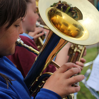 Young girl playing a tuba