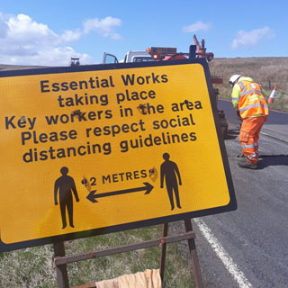 Staff carrying out resurfacing work