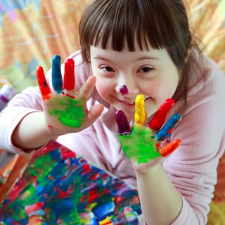 Child with painted hands