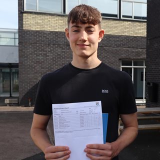 Student collecting GCSE results 