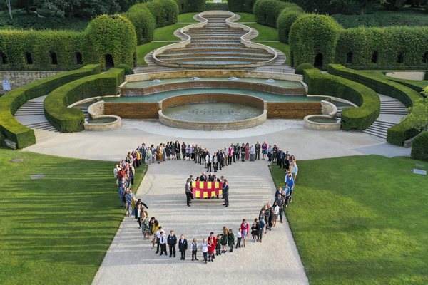 People standing in heart shape at Alnwick Garden