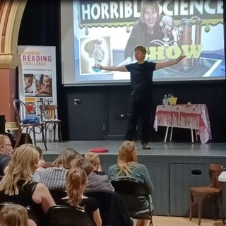 Author Nick Arnold captivates audience on stage at his Horrible science show