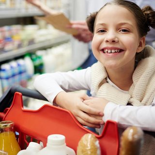 Happy girl with trolley