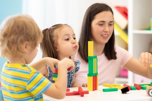 Children with adult playing