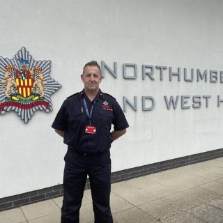 Jim McNeil in front of NFRS building