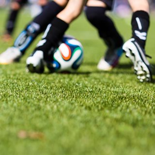 Photo of footballers legs, playing on 3G pitch