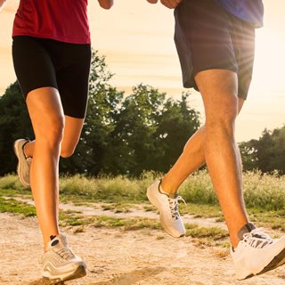 Photo of man and woman's legs when running