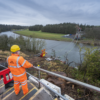 View across the River Tweed with whole bridge deck missing