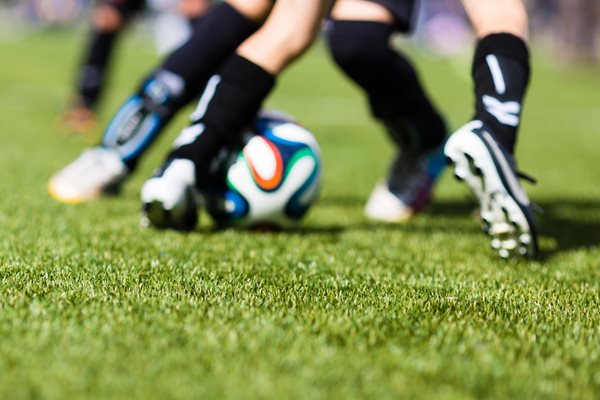 Photo of footballers legs, playing on 3G pitch