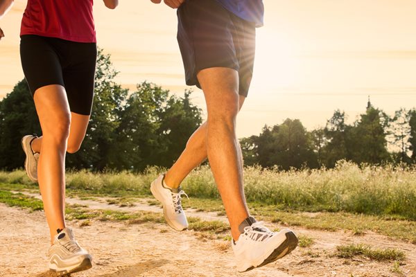 Photo of man and woman's legs when running