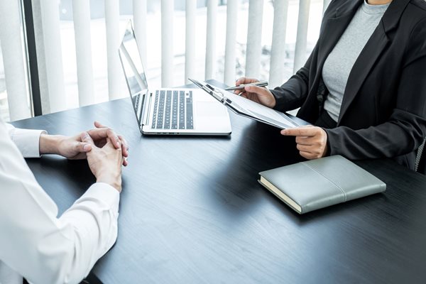 Woman conducting an interview with a man