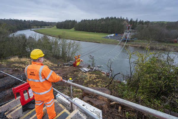 View across the River Tweed with whole bridge deck missing